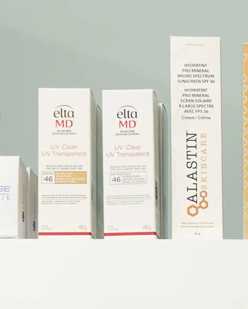 Skincare boxes on a white shelf at the clinic