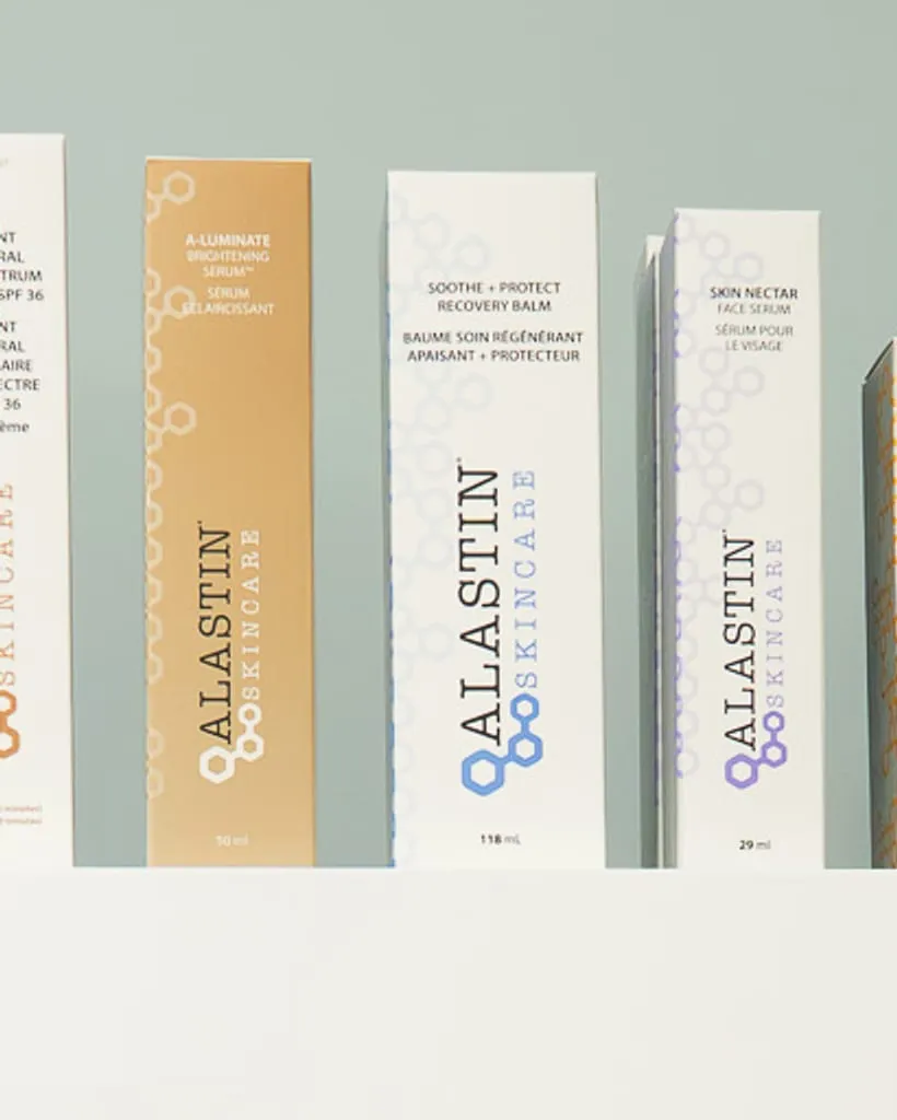 A row of professional skincare boxes on a clinic shelf
